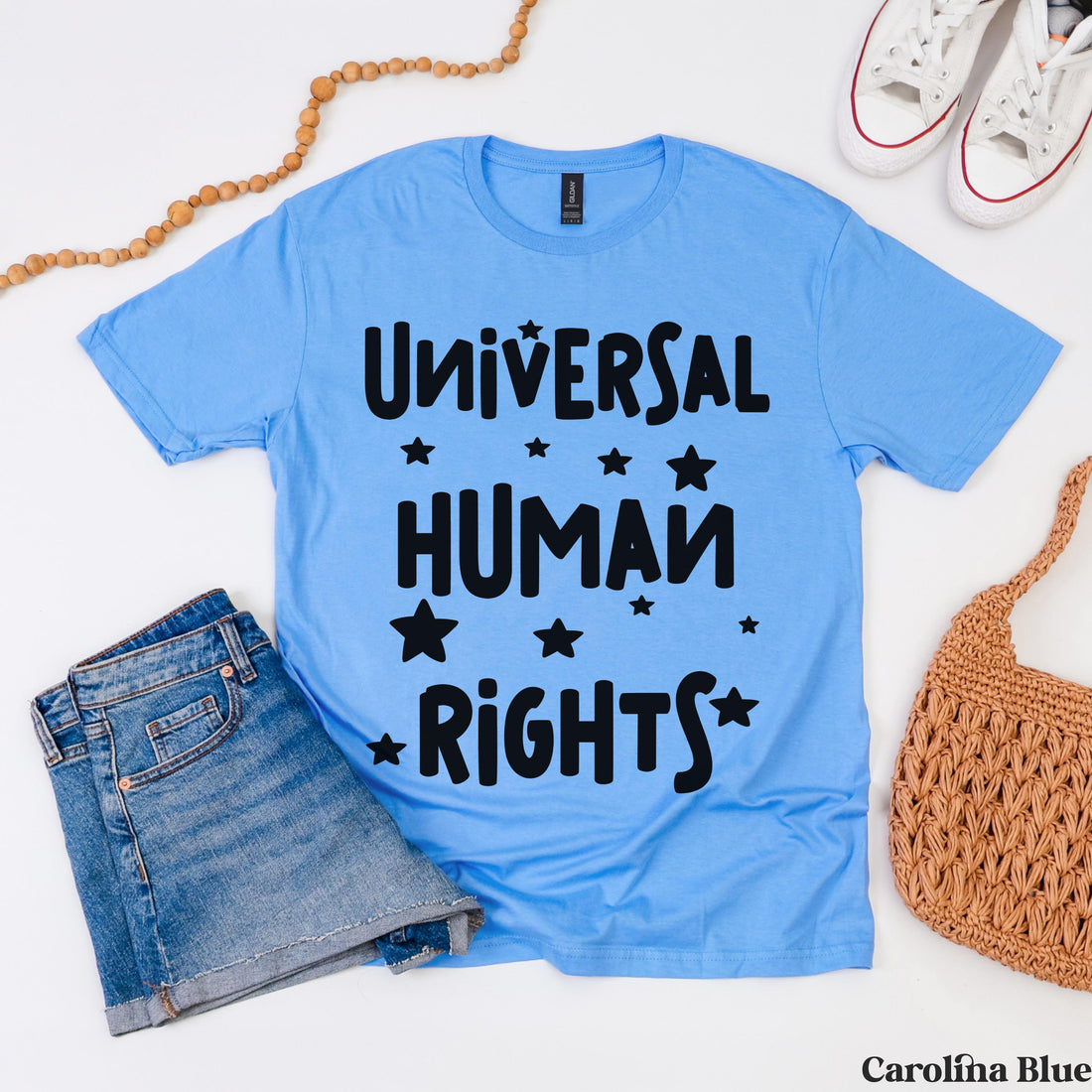 Blue t-shirt with &amp;quot;Universal Human Rights&amp;quot; text and stars.