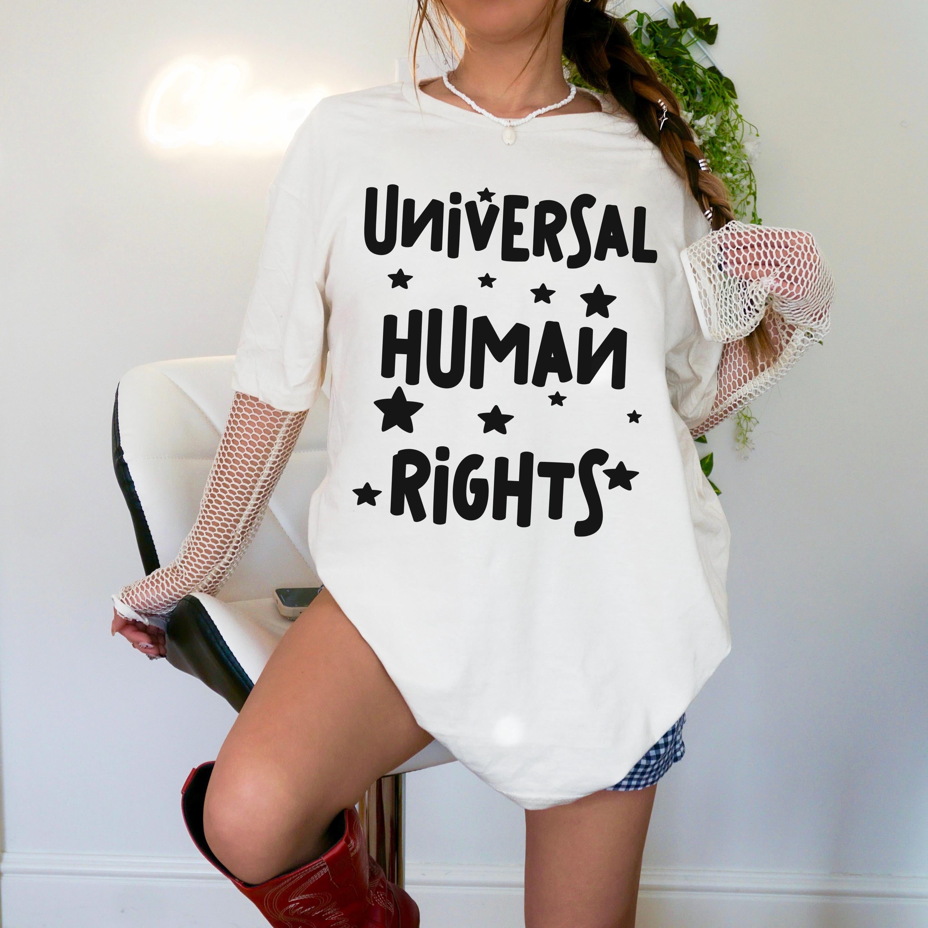 Cream t-shirt with black text &amp;quot;Universal Human Rights&amp;quot; and stars.