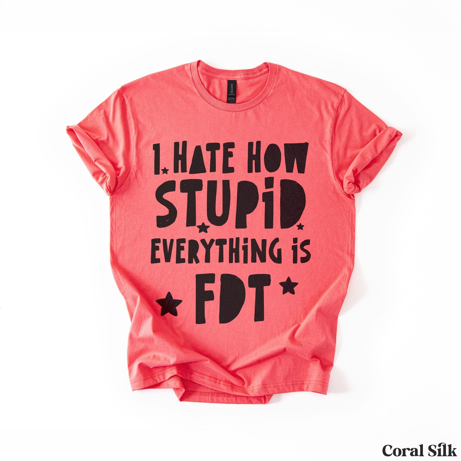 Coral t-shirt with black text saying &amp;quot;I hate how stupid everything is.&amp;quot;