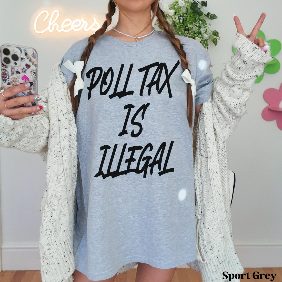 Grey t-shirt with &amp;quot;POLL TAX IS ILLEGAL&amp;quot; text, worn by a person.