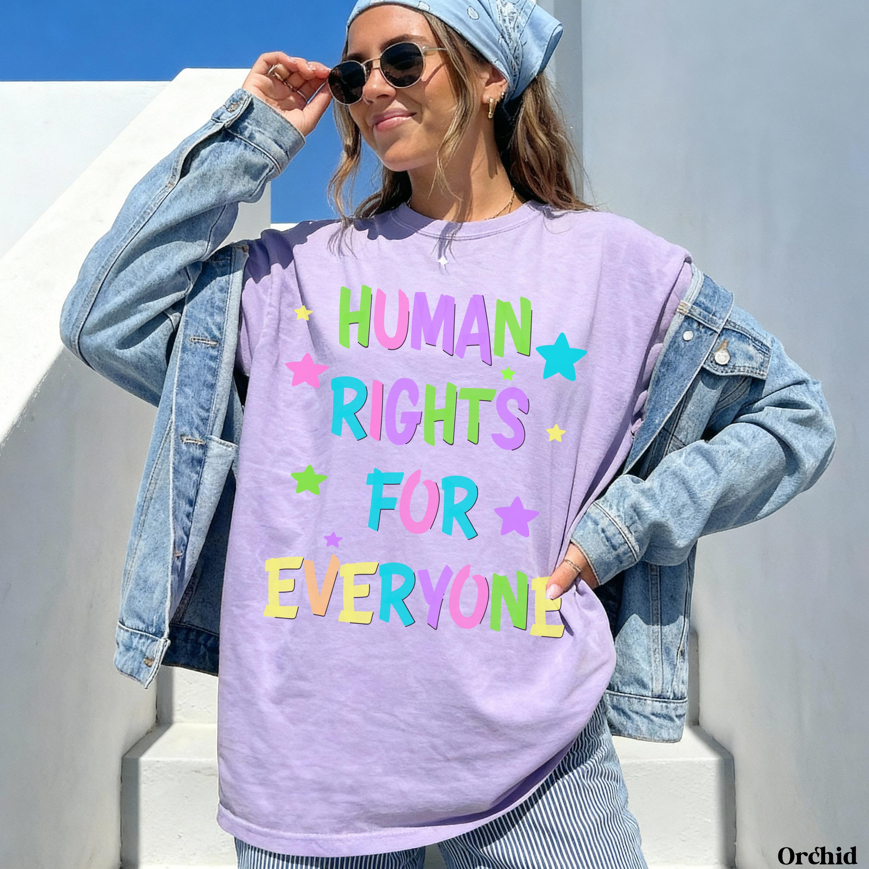 Purple t-shirt with &amp;quot;HUMAN RIGHTS FOR EVERYONE&amp;quot; and stars in colorful text.