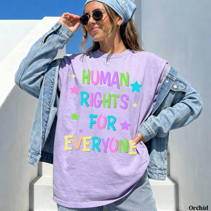 Purple t-shirt with &amp;quot;HUMAN RIGHTS FOR EVERYONE&amp;quot; and stars in colorful text.