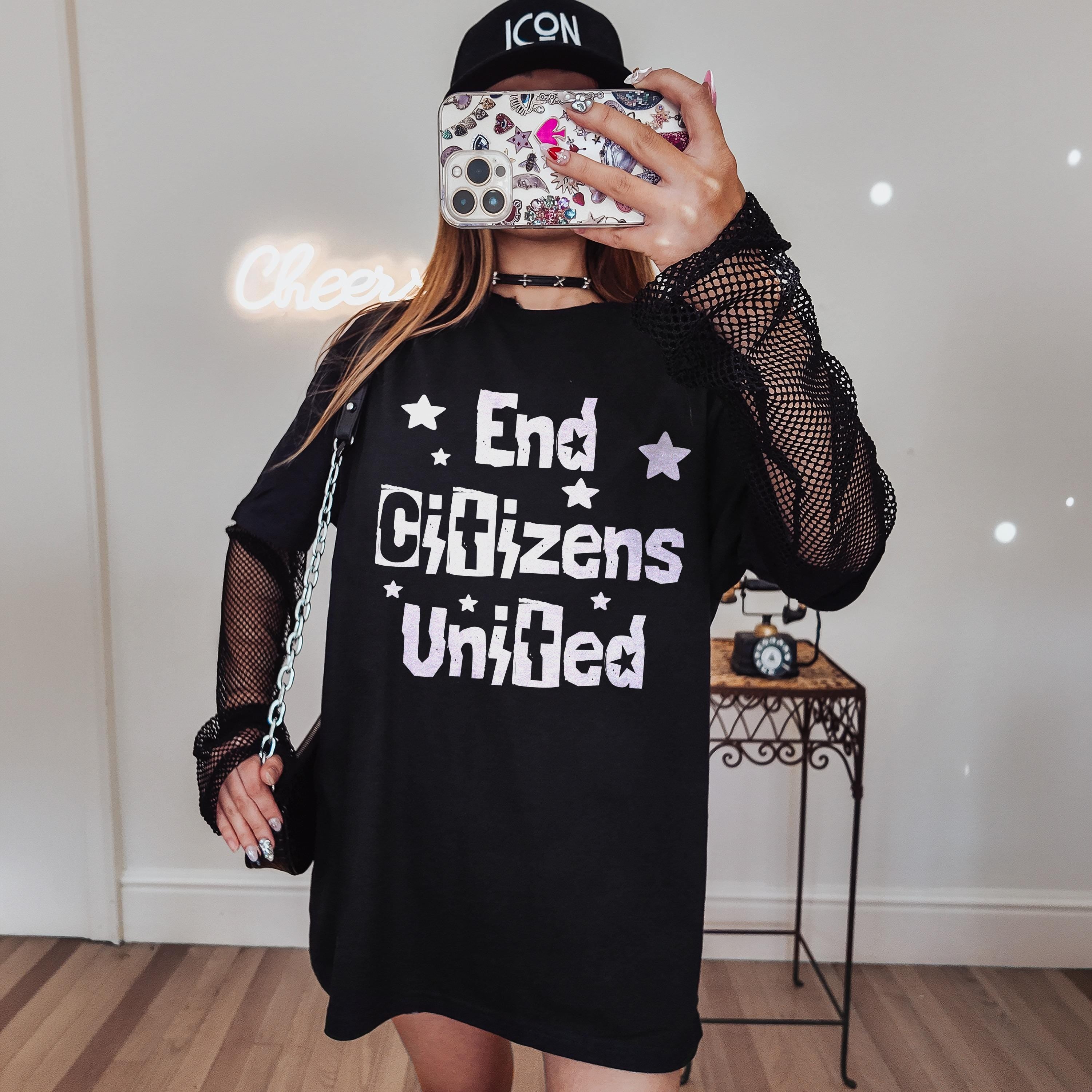 Black t-shirt with &amp;quot;End Citizens United&amp;quot; and star graphics, worn by a person holding a phone.