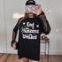 Black t-shirt with "End Citizens United" and star graphics, worn by a person holding a phone.