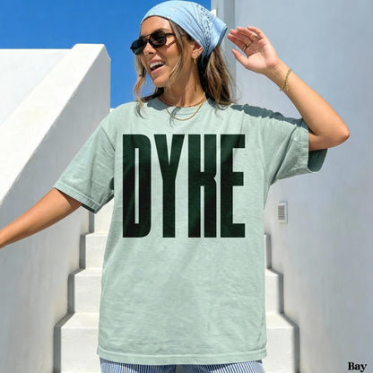 Pale green t-shirt with bold black &amp;quot;DYKE&amp;quot; text.