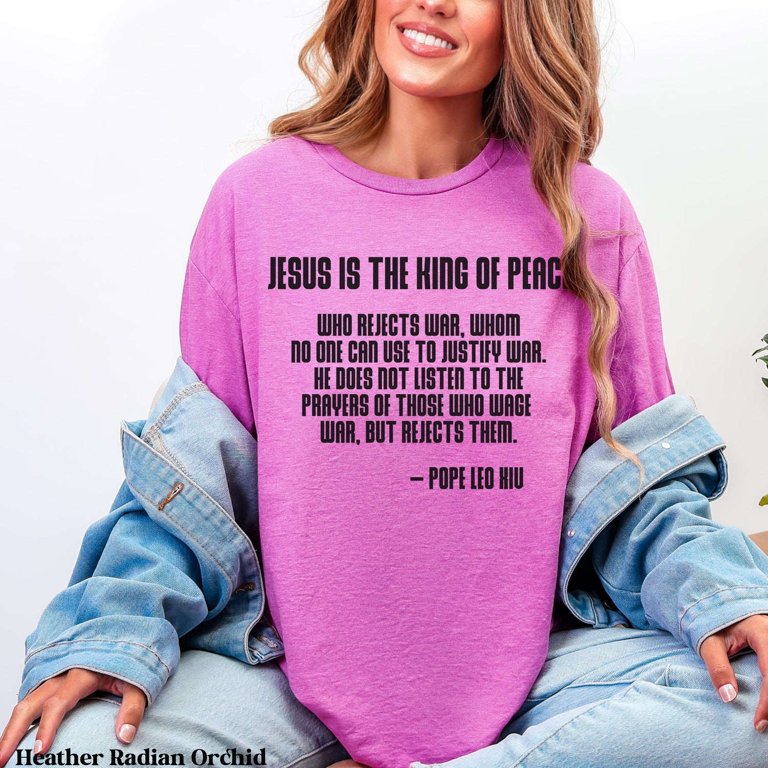 Purple t-shirt with quote by Pope Leo XII about peace and war.