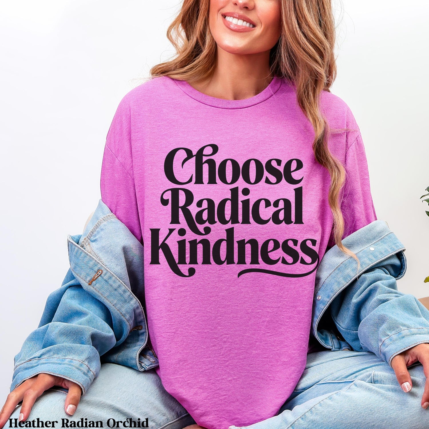 Woman wearing pink t-shirt with &amp;quot;Choose Radical Kindness&amp;quot; text.