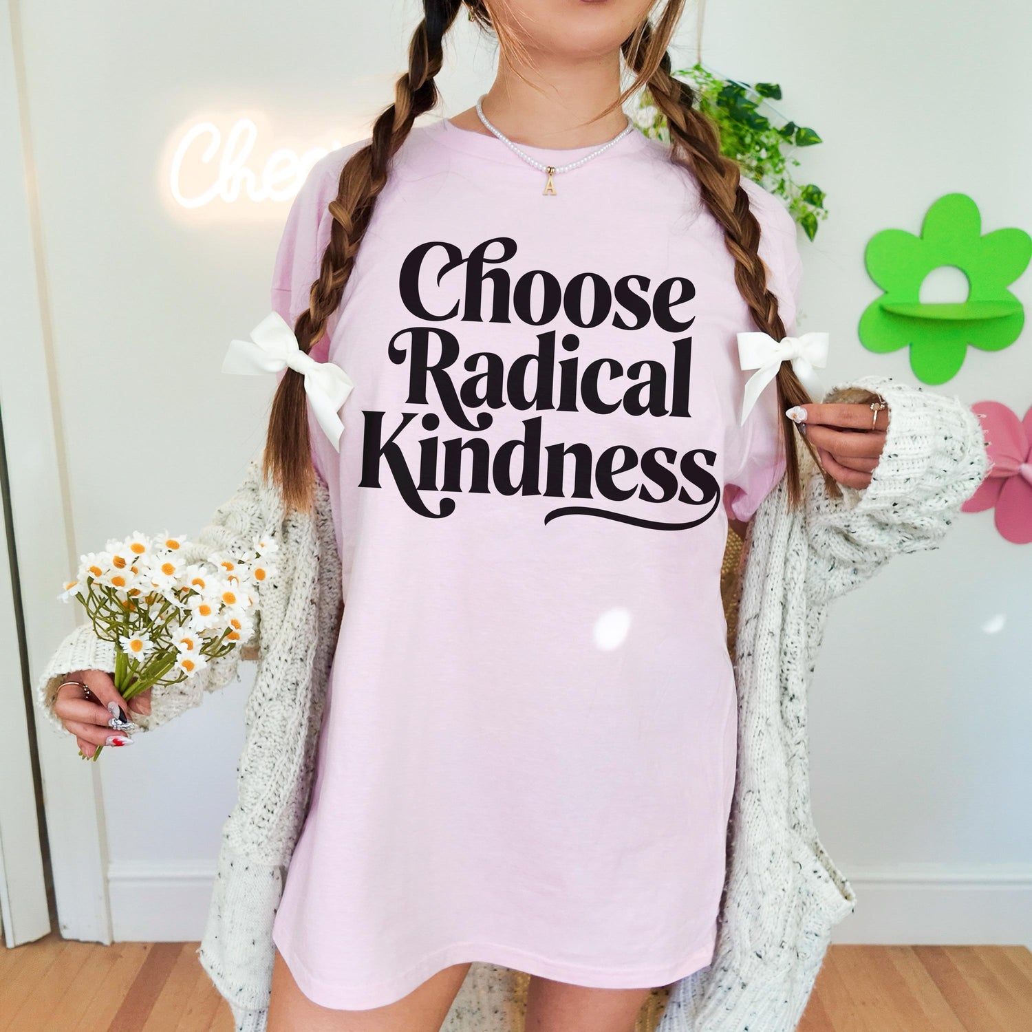 Pink t-shirt with &amp;quot;Choose Radical Kindness&amp;quot; text and braided pigtails.