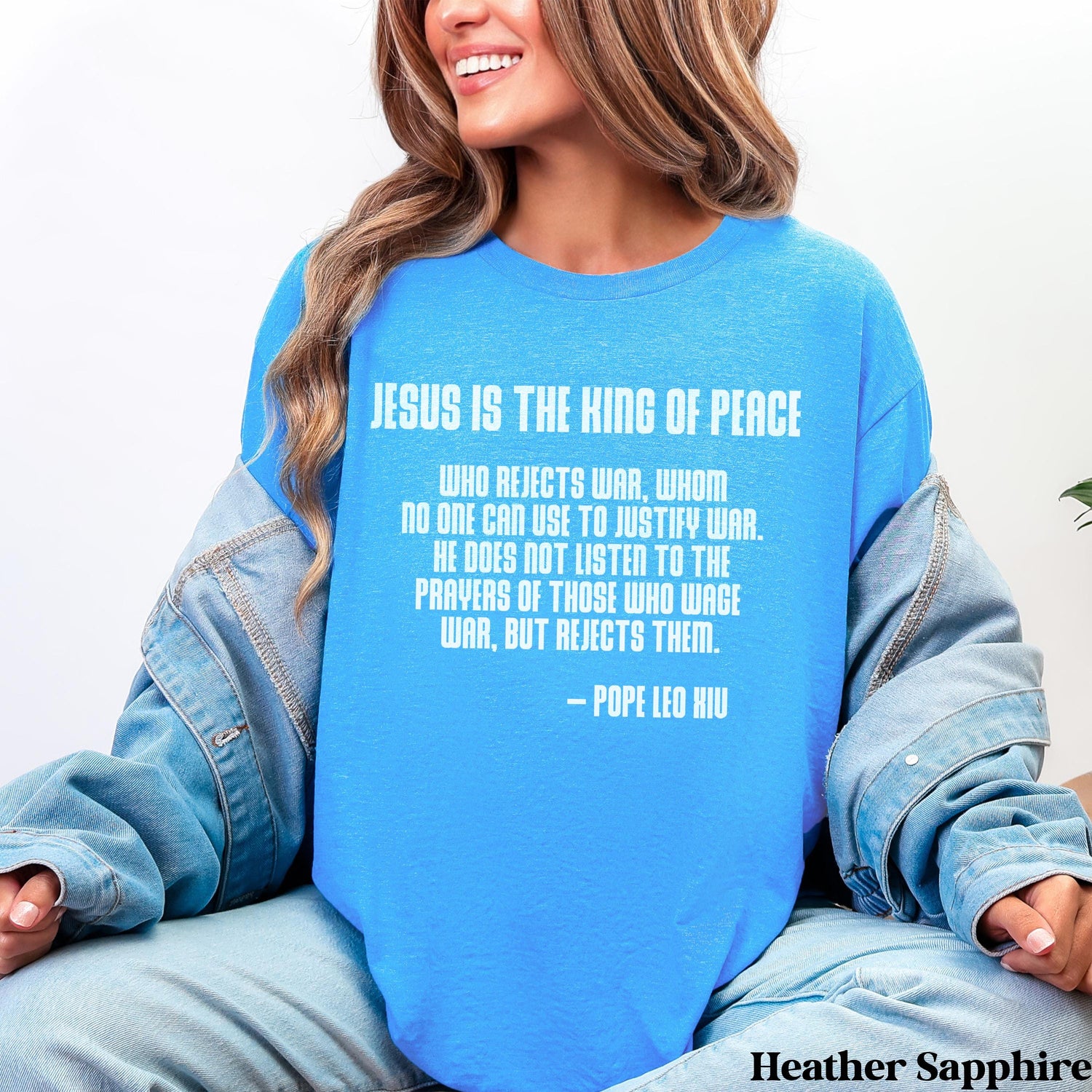 Blue t-shirt with &amp;quot;Jesus is the King of Peace&amp;quot; quote from Pope Leo XIII.