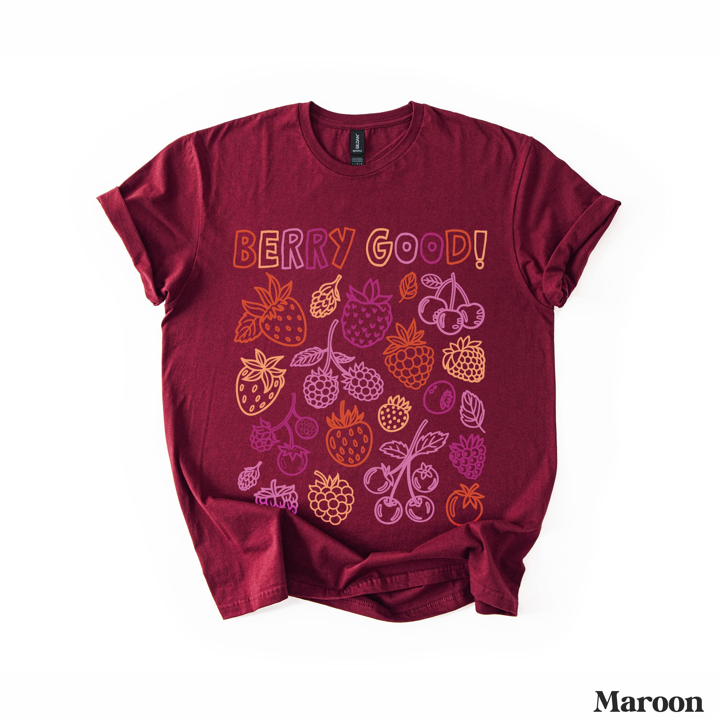 Maroon t-shirt with colorful fruit illustrations and &amp;quot;BERRY GOOD!&amp;quot; text.