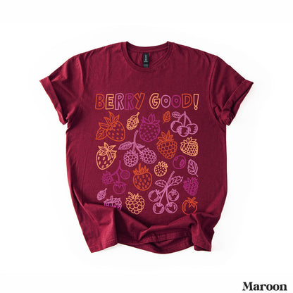Maroon t-shirt with colorful fruit illustrations and &amp;quot;BERRY GOOD!&amp;quot; text.