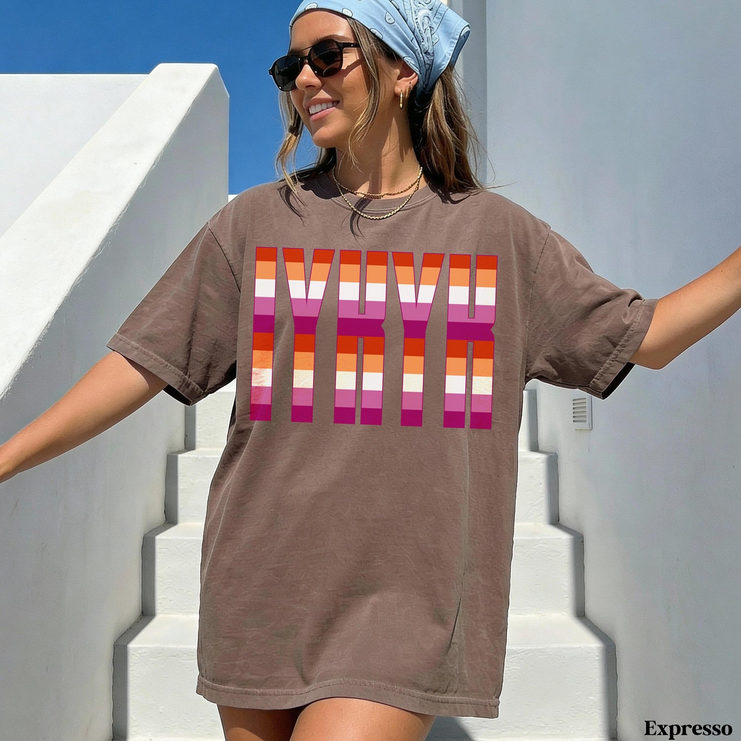 Brown t-shirt with colorful LGBTQ+ pride stripes forming the letters YNK.