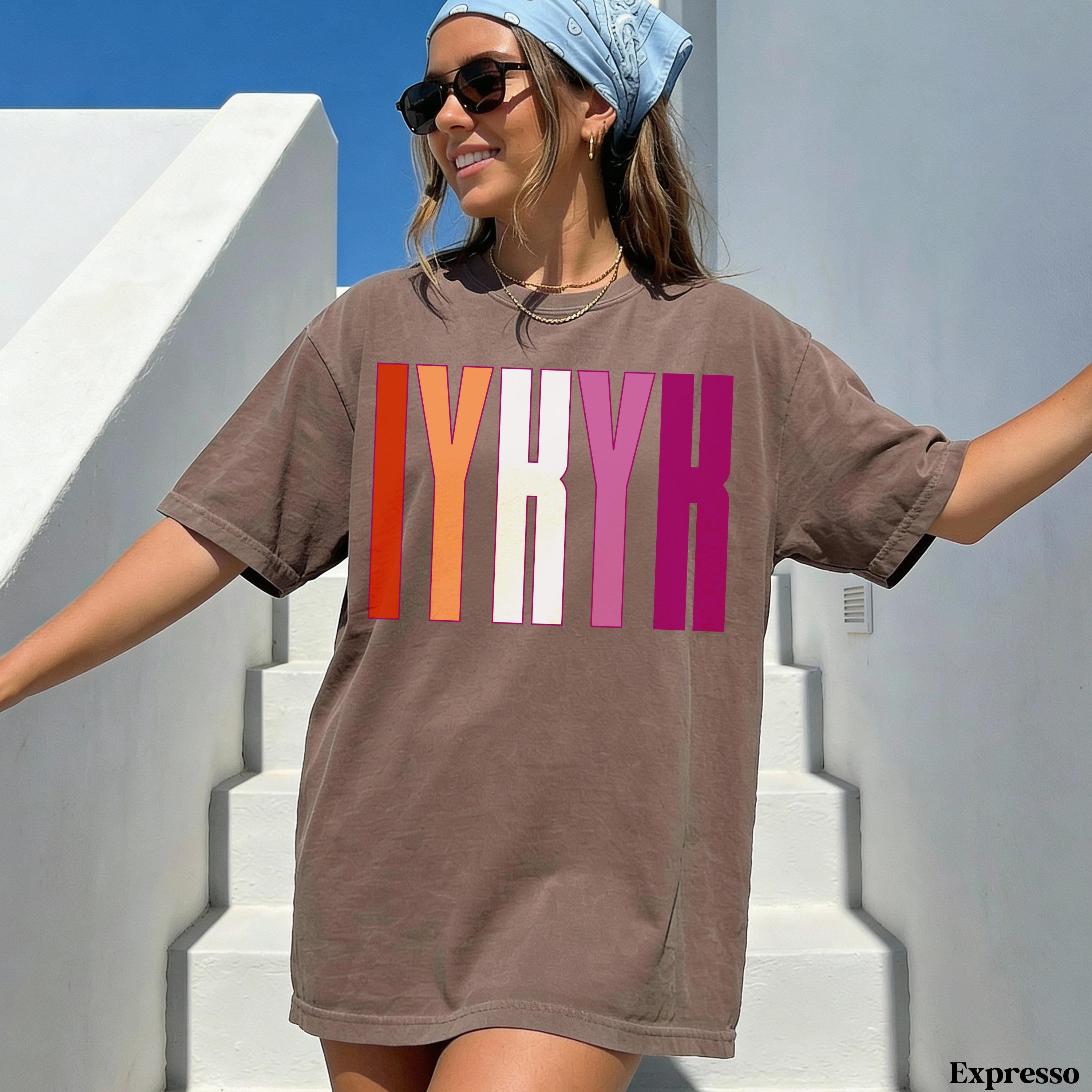Brown t-shirt with &amp;quot;LYRH&amp;quot; in colorful stripes on chest.