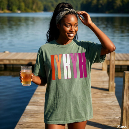 Woman wearing green t-shirt with &amp;quot;IYKYK&amp;quot; in colorful block letters.