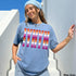 Blue t-shirt with layered "NYC" text in pride flag colors.