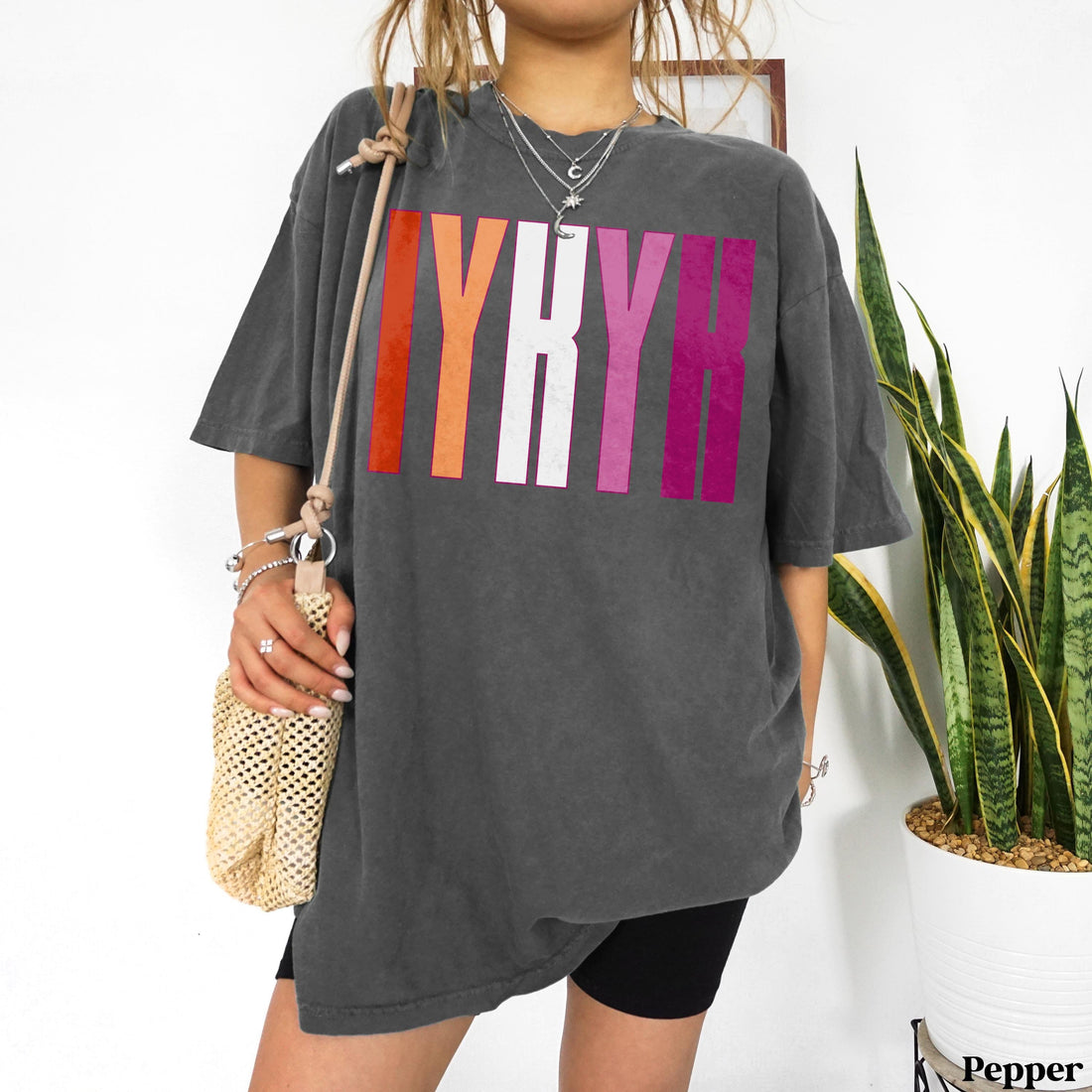 Oversized dark grey t-shirt with colorful &amp;quot;LGB&amp;quot; text and pride stripes.