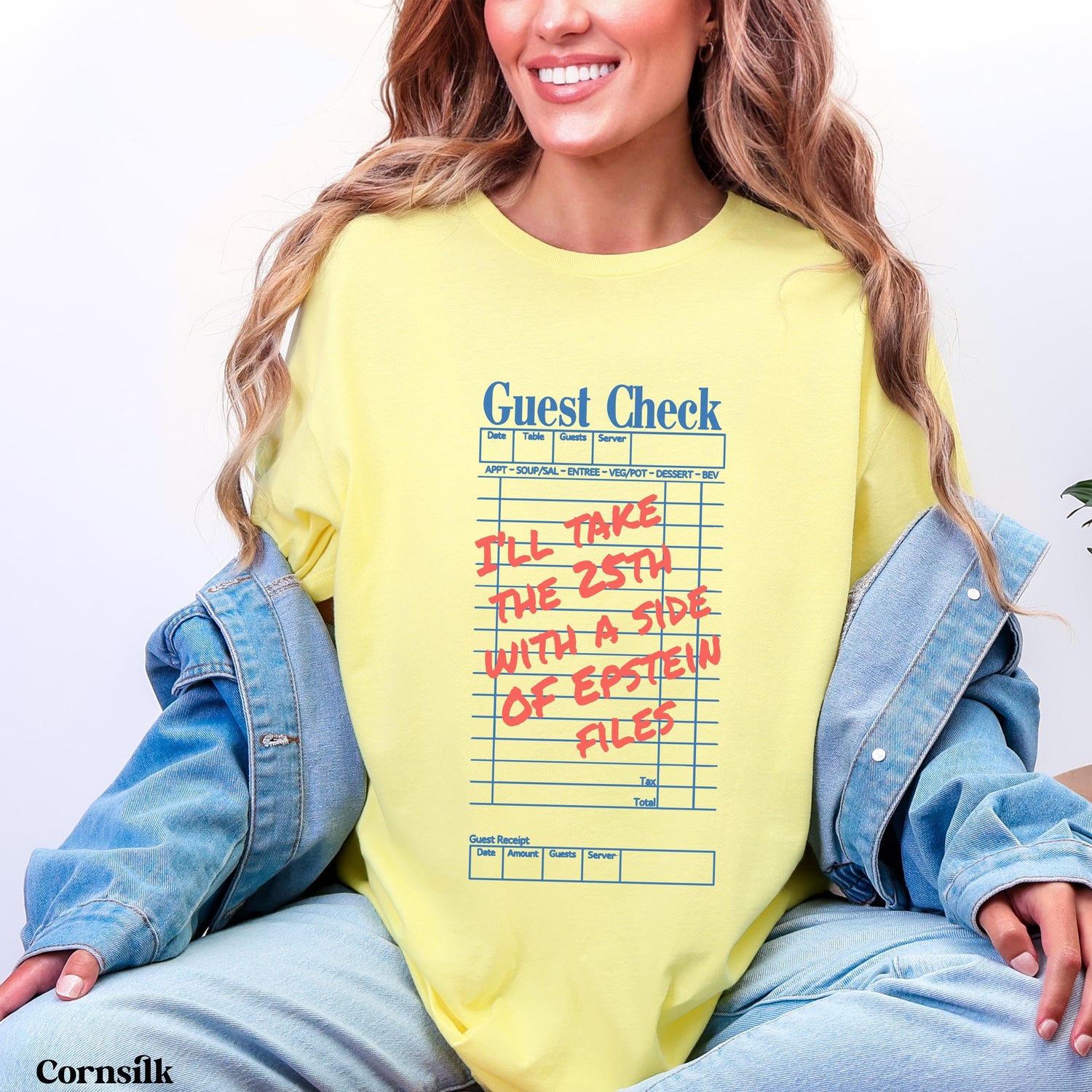 Yellow t-shirt with &amp;quot;Guest Check&amp;quot; and &amp;quot;Epstein Files&amp;quot; text.