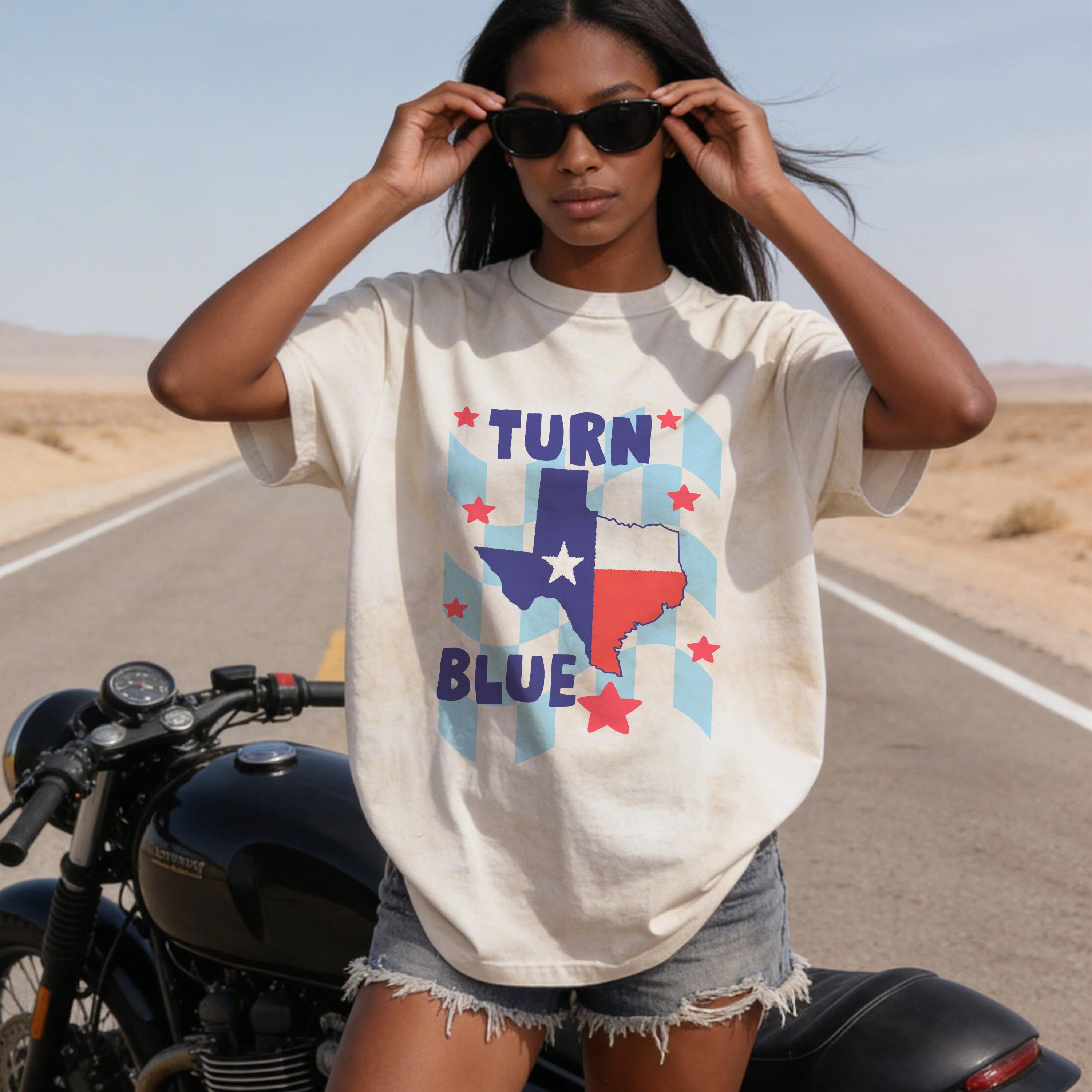 Woman wearing a Texas &amp;quot;Turn Blue&amp;quot; t-shirt on a road.