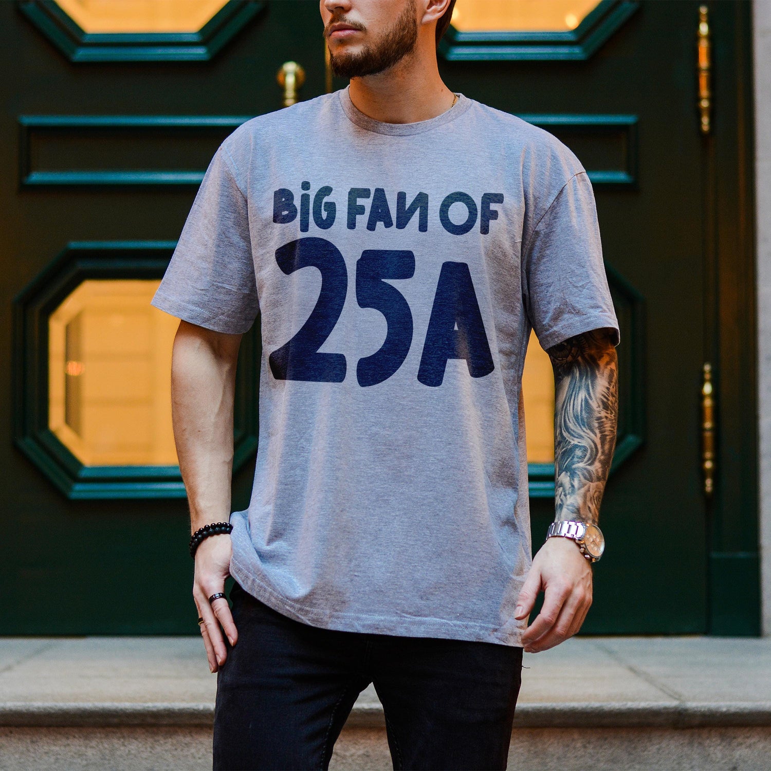 Gray t-shirt with &amp;quot;BIG FAN OF 25A&amp;quot; text, worn by a man.