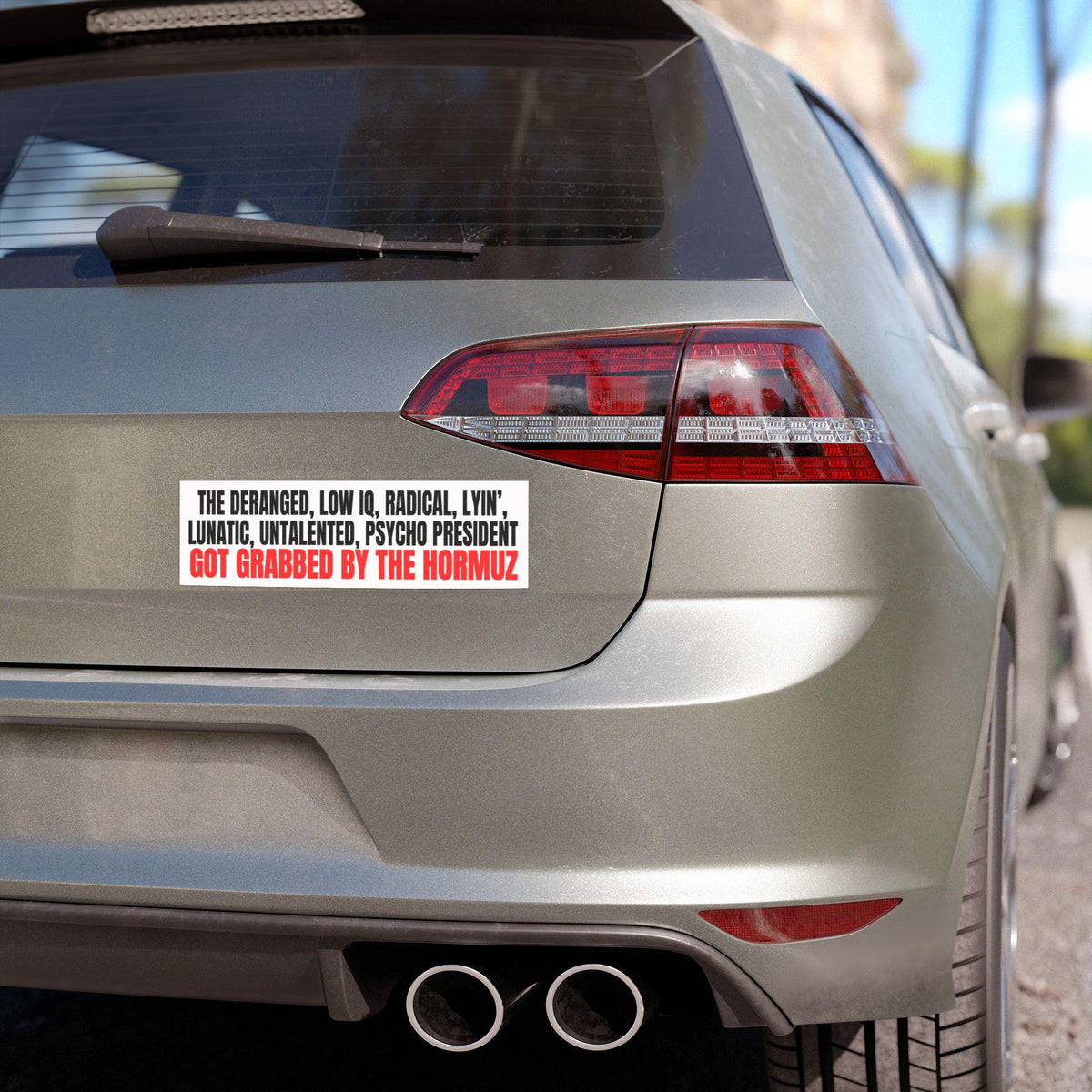 Car bumper sticker with text about a president and Hormuz.