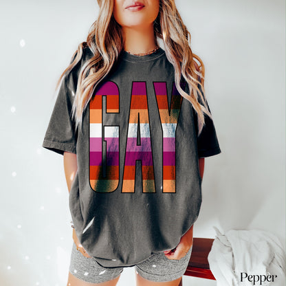 Dark grey t-shirt with &amp;quot;GAY&amp;quot; in rainbow stripes, worn by a person.