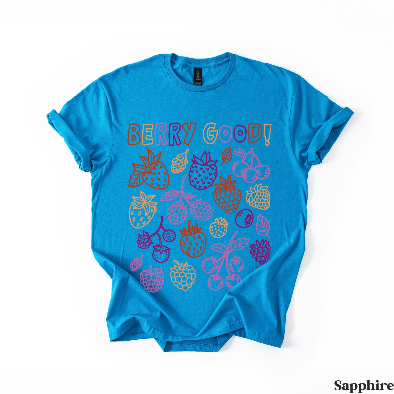 Blue t-shirt with colorful berry illustrations and text &amp;quot;BERRY GOOD!&amp;quot;.
