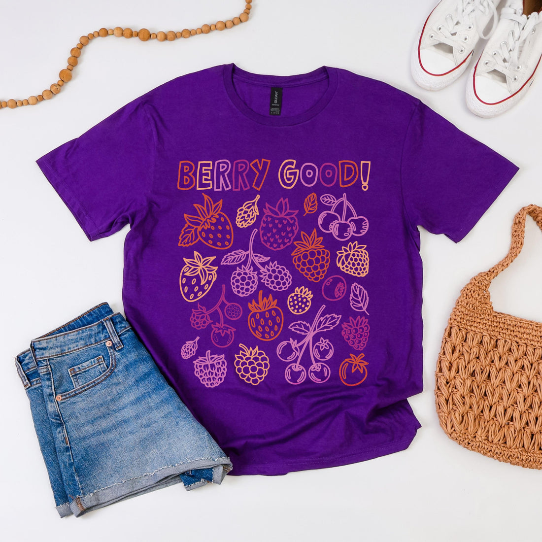 Purple t-shirt with &amp;quot;Berry Good!&amp;quot; text and berry illustrations.