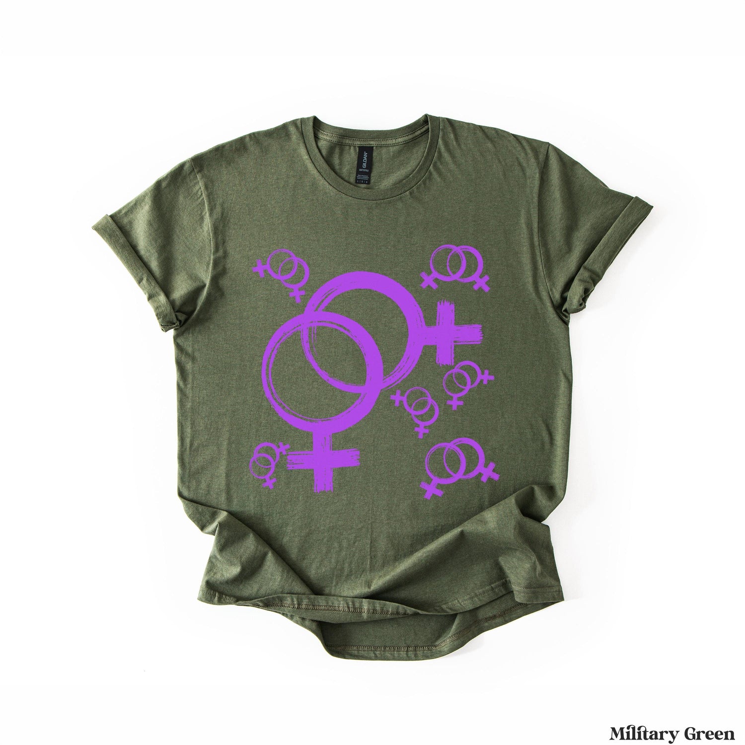 Olive green t-shirt with purple Venus symbols and smaller symbols scattered.