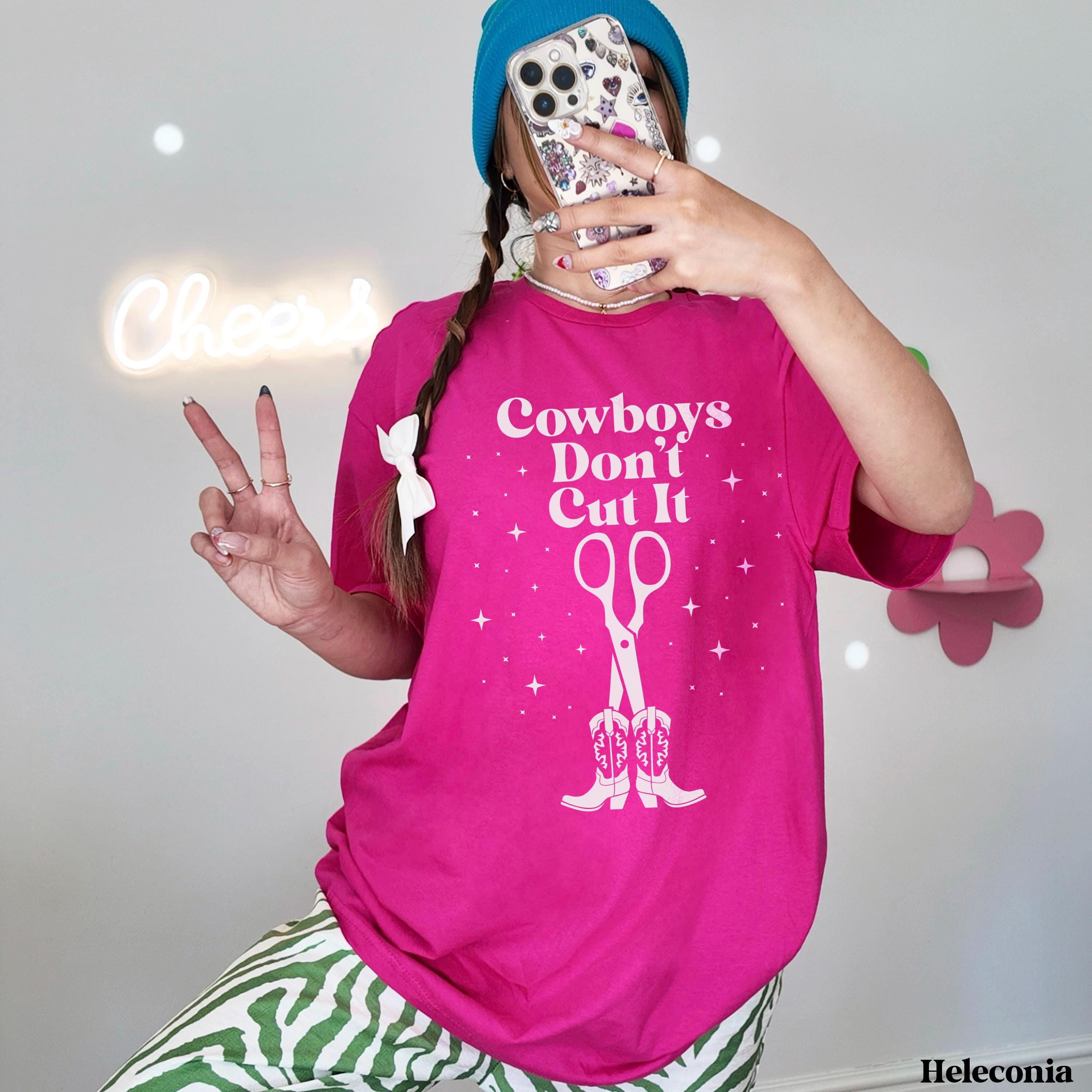 Woman in pink t-shirt with &amp;quot;Cowboys Don&amp;