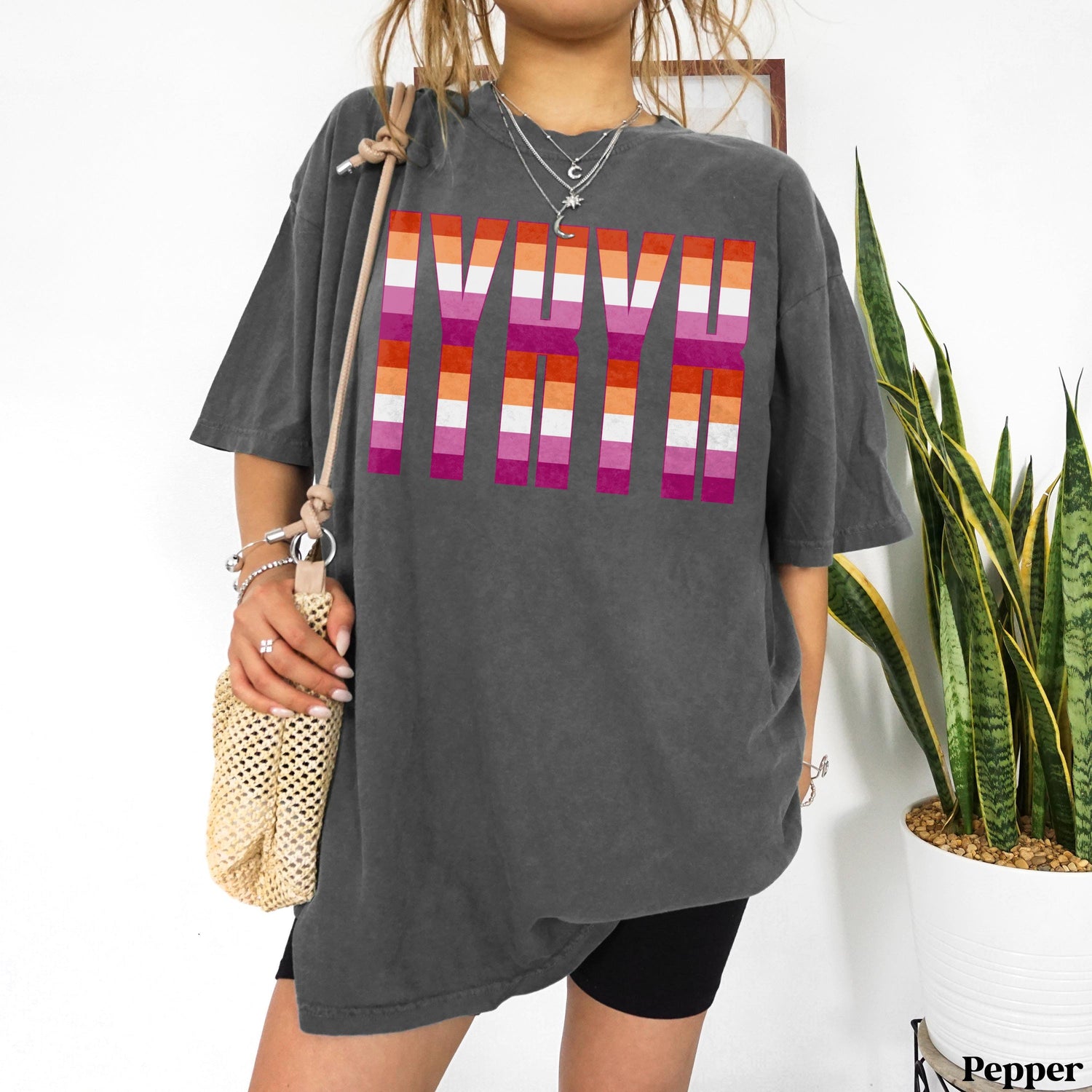 T-shirt with lesbian pride flag stripes forming the word &amp;quot;LOVE&amp;quot;.