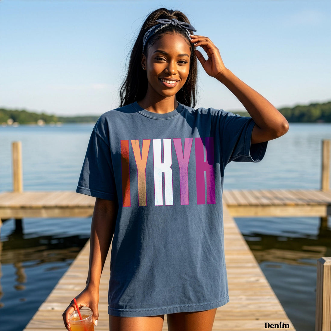 Woman wearing a navy t-shirt with colorful &amp;quot;MYRI&amp;quot; text and a headband.