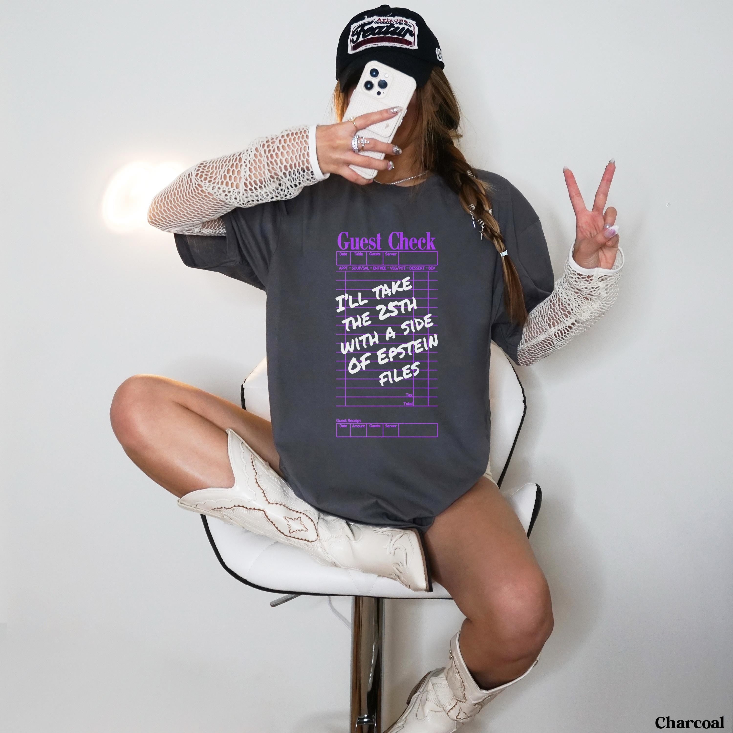 Charcoal t-shirt with &amp;quot;Guest Check&amp;quot; graphic about Epstein files.