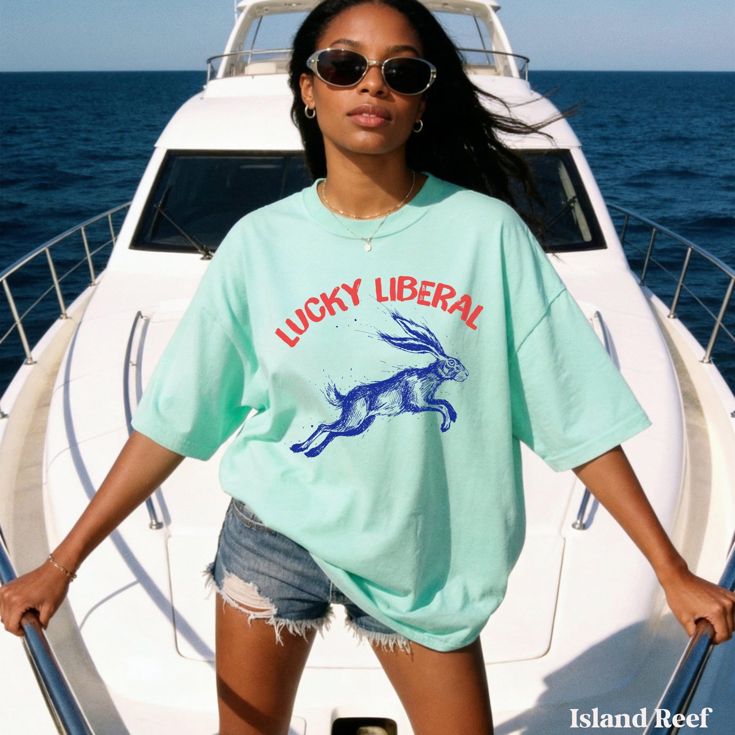 Woman in mint t-shirt with jumping rabbit graphic and &amp;quot;Lucky Liberal&amp;quot; text.