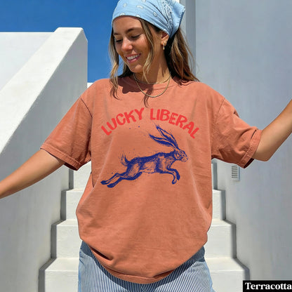 Terracotta t-shirt with a jumping blue rabbit and &amp;quot;Lucky Liberal&amp;quot; text.