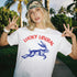 White t-shirt with "Lucky Liberal" text and blue rabbit graphic.