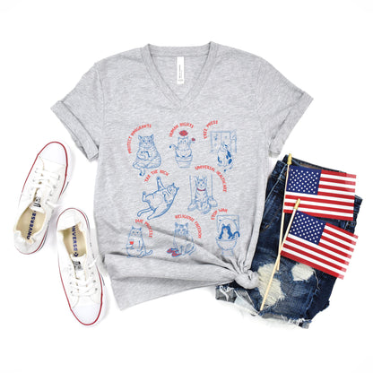 T-shirt with blue line art cats advocating for human rights and social justice.