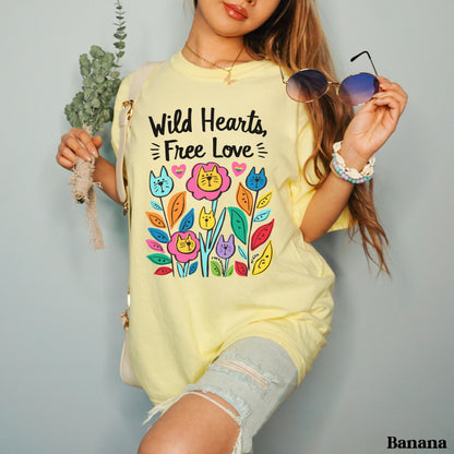 Yellow t-shirt with &amp;quot;Wild Hearts, Free Love&amp;quot; text and colorful cat floral design.