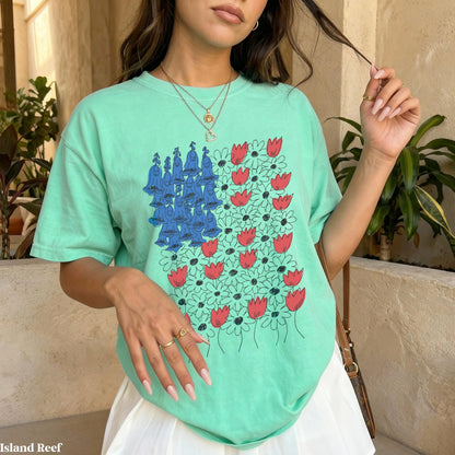Mint green t-shirt with a floral design of bluebells and tulips.
