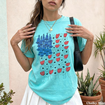 Turquoise t-shirt with a bluebell and red tulip floral print.