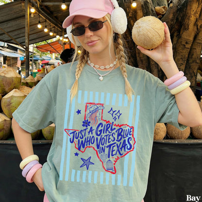 Woman wearing a t-shirt that says &amp;quot;Just a girl who votes blue in Texas&amp;quot;.