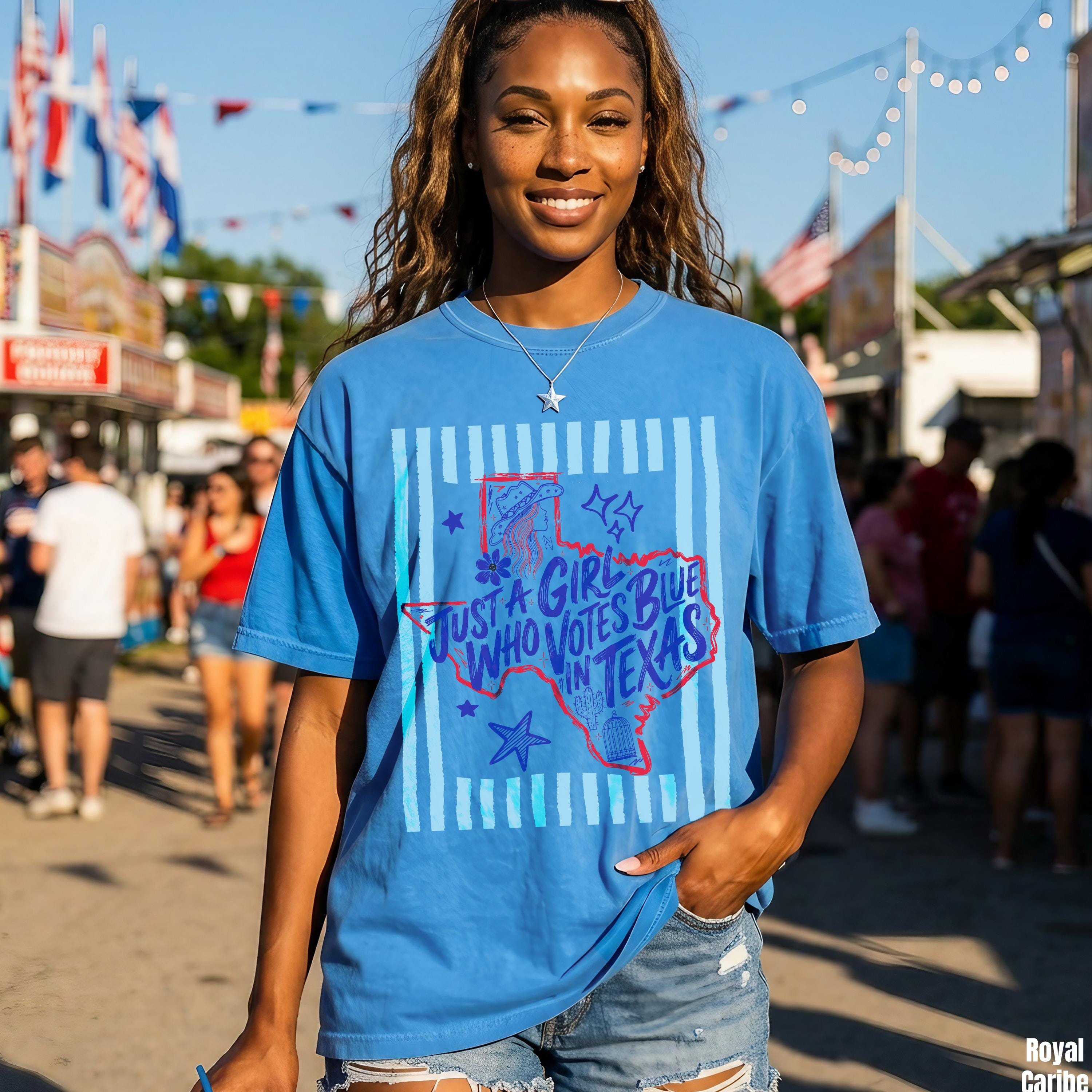 Woman in blue t-shirt with Texas outline and &amp;quot;Just a girl who votes blue in Texas&amp;quot; text.