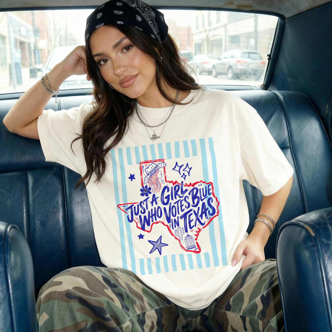 Woman in bandana and graphic tee with &amp;quot;Just a Girl Who Votes Blue in Texas&amp;quot; text.