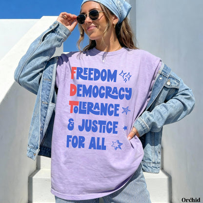 Woman wearing a purple t-shirt with &amp;quot;FREEDOM DEMOCRACY TOLERANCE JUSTICE FOR ALL&amp;quot; text.