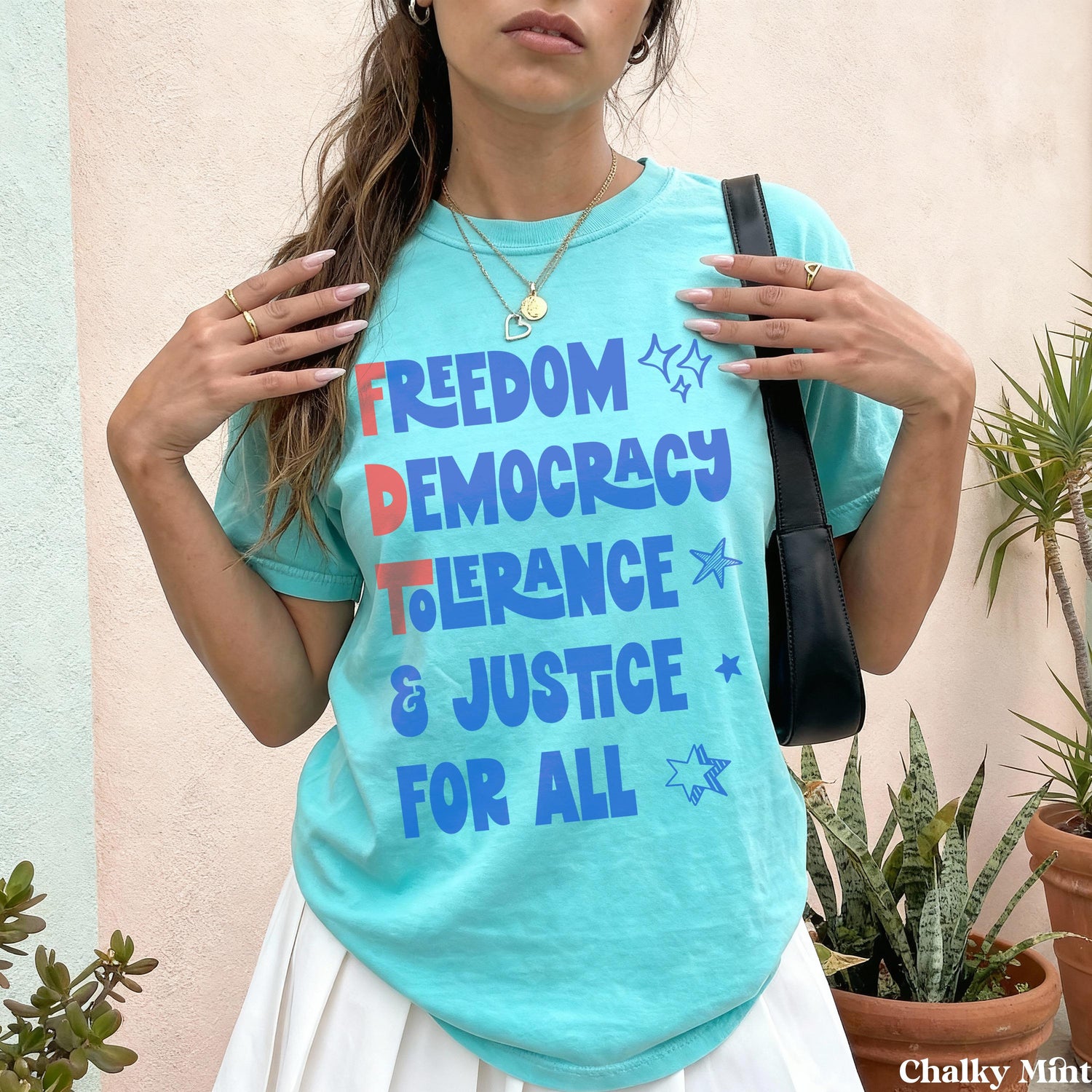 Aqua t-shirt with &amp;quot;FREEDOM DEMOCRACY TOLERANCE &amp; JUSTICE FOR ALL&amp;quot; text.