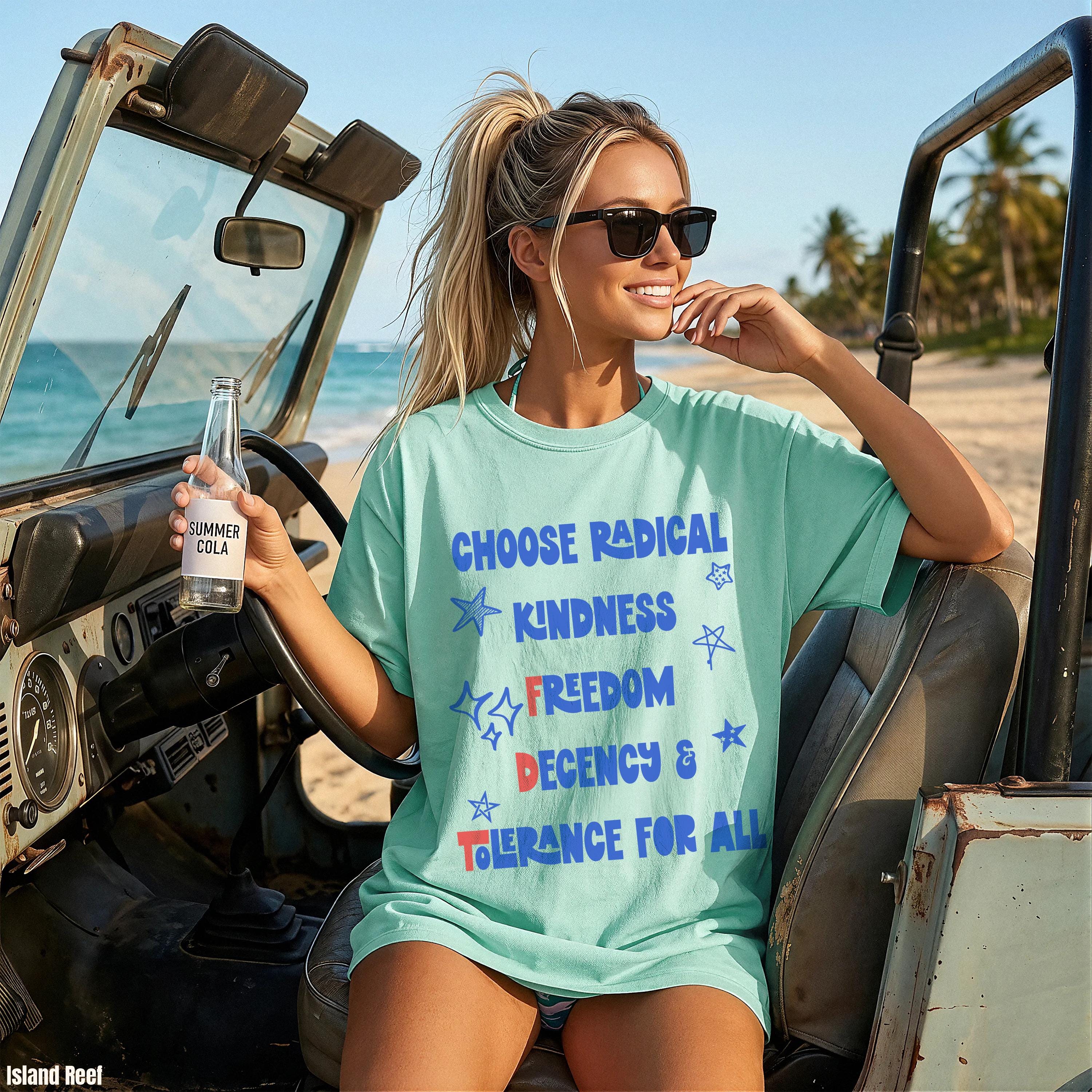 Woman in mint t-shirt with text &amp;quot;CHOOSE RADICAL KINDNESS FREEDOM DECENCY &amp; TOLERANCE FOR ALL&amp;quot;.