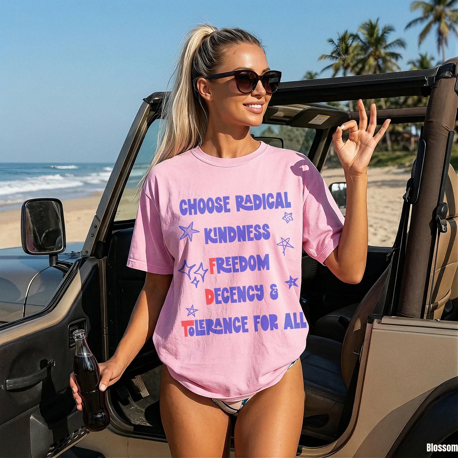 Woman in pink t-shirt with &amp;quot;Choose radical kindness freedom tolerance&amp;quot; text.