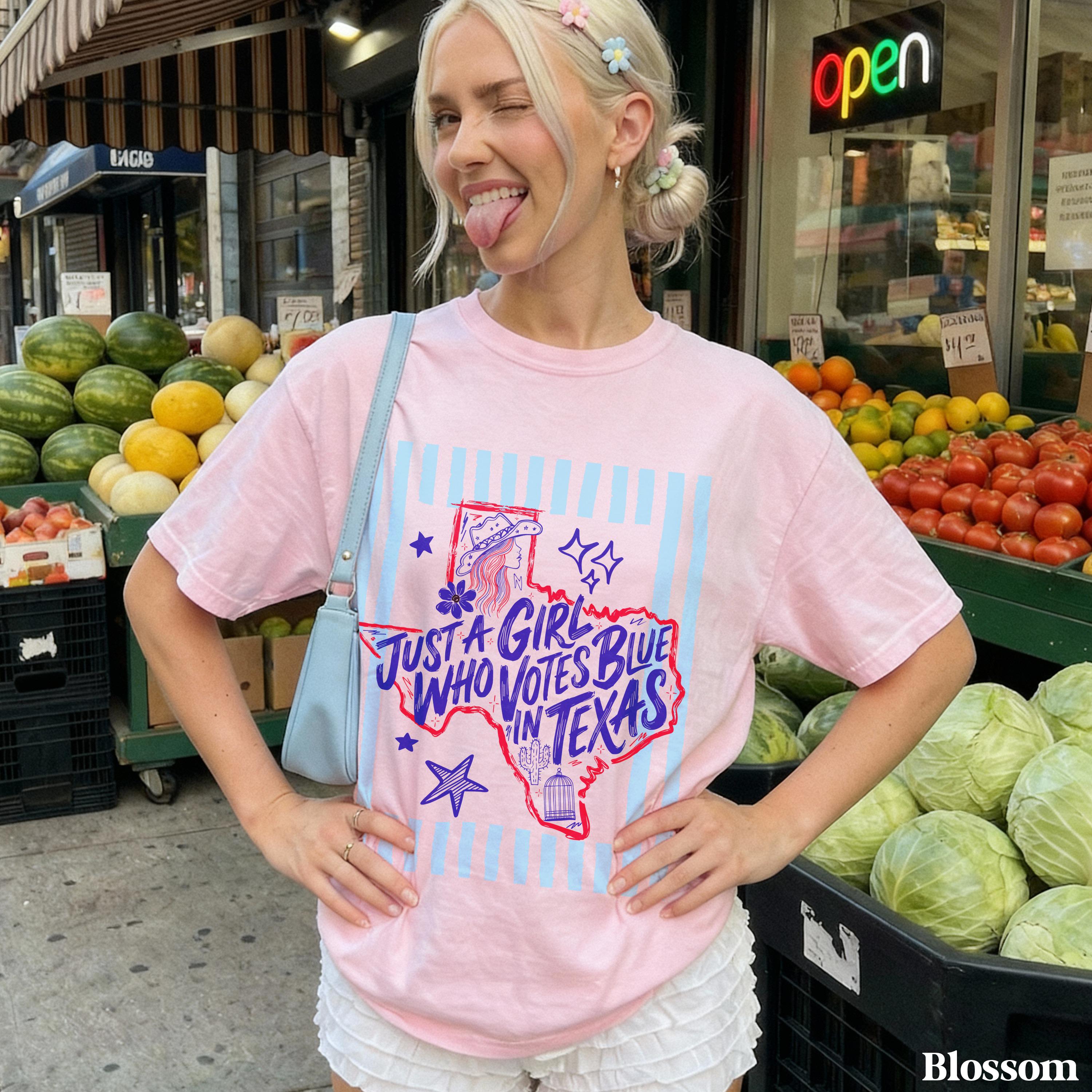 Pink t-shirt with blue Texas graphic and text &amp;quot;JUST A GIRL WHO VOTES BLUE IN TEXAS&amp;quot;.