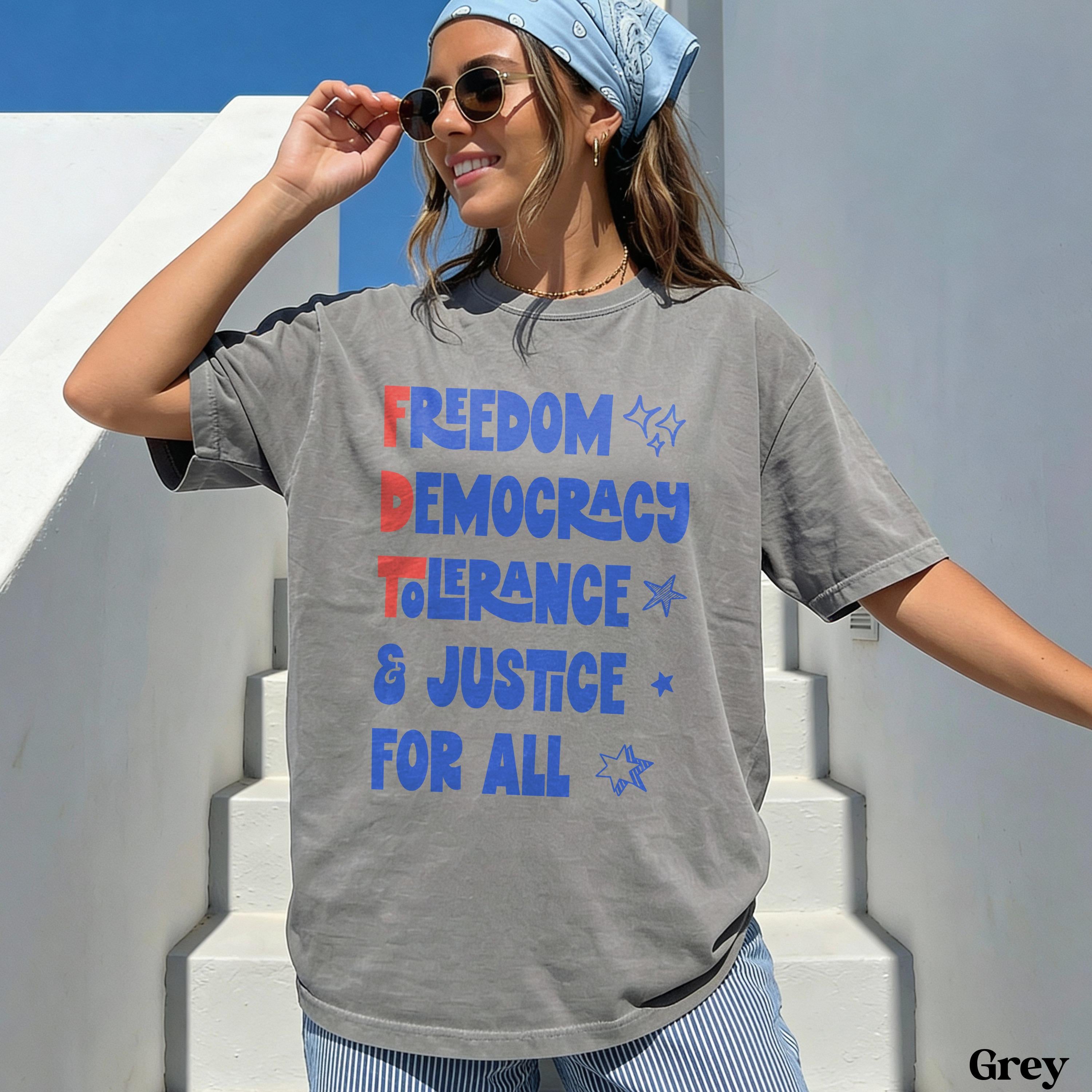 Gray t-shirt with &amp;quot;Freedom Democracy Tolerance &amp; Justice For All&amp;quot; text.