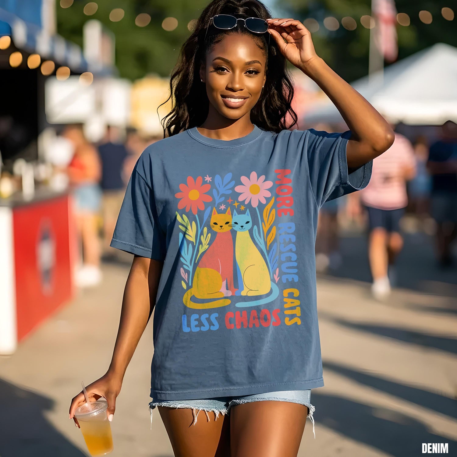 Denim t-shirt with colorful cats and flowers graphic, reading &amp;quot;more rescue cats, less chaos.&amp;quot;