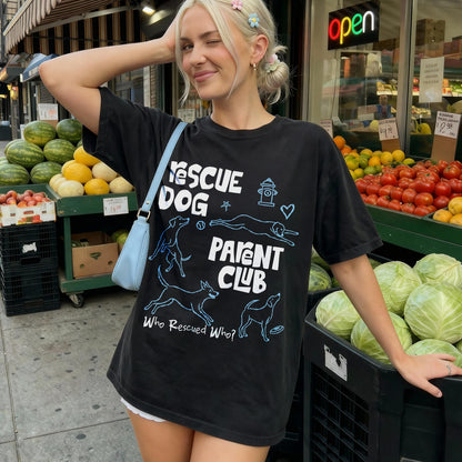 Black t-shirt with &amp;quot;RESCUE DOG PARENT CLUB&amp;quot; text and dog illustrations.